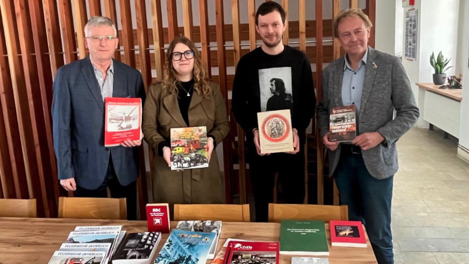 Photo by CTIF. As seen in the picture from left to right: Peter Wagner (CTIF Center of Fire Statistics), Iveta Krpalkova (Head of archive Pribyslav), Jan Karel (Archive and Library Pribyslav), and Harald Herweg (CTIF Center of Fire Statistics).