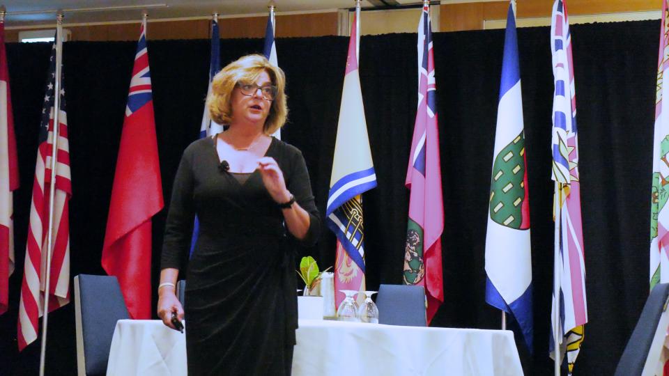 Clara Capano speaking on mental wellbeing for first responders at Fire-Rescue Canada 2026. 