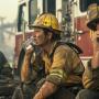 Public DomainAI Generated Firefighters Taking Break Exhausted firefighters rest and hydrate against the backdrop of a smoky scene after combating a blaze. Downloaded from Stockcake.com 