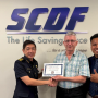 Teong How Hwa (SCDF Deputy Commissioner for Strategy &amp; Corporate Services) - left, Dr. Peter Wagner (Chair, Center for Fire Statistics of CTIF) -middle, and Noor Azam Kasiri (Senior Assistant Director for Operations Readiness in the Operations Department of SCDF) – right.